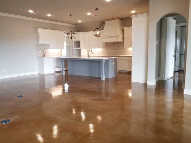 a brown polished concrete floor